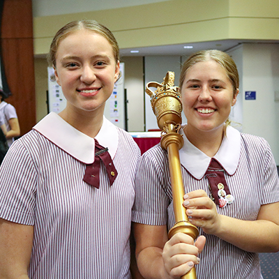 students holding mace